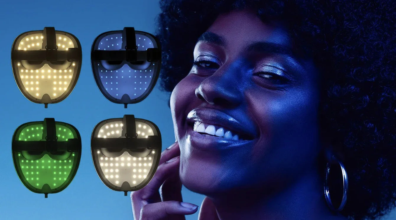Woman smiling beside four LED light therapy masks in yellow, blue, green, and white for skincare and anti-aging.